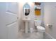 Charming powder room with pedestal sink, white toilet, and decor at 13651 Ashlar Slate Pl, Riverview, FL 33579