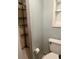 Cozy bathroom featuring tiled shower and neutral colored walls at 1379 Pine St, Clearwater, FL 33756