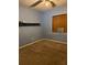 Bedroom showcasing a simple design with carpet floors, a window, and neutral-colored walls at 1379 Pine St, Clearwater, FL 33756
