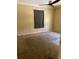 Bedroom featuring paneled walls and carpeted floor; perfect for relaxation and comfort at 1379 Pine St, Clearwater, FL 33756
