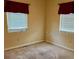 Cozy bedroom with windows providing natural light and carpeted floors at 1379 Pine St, Clearwater, FL 33756