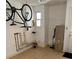 Garage area showing storage and a bicycle hanging from the wall at 1379 Pine St, Clearwater, FL 33756