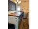 Rustic kitchen with a butcher block island, ample storage, and stainless steel appliances at 1379 Pine St, Clearwater, FL 33756