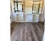 Bright living room featuring custom built-in shelving and elegant flooring at 1379 Pine St, Clearwater, FL 33756
