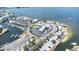 Overhead view of waterfront restaurant on a beach with marina, parking, and direct water access at 13926 Helen Ave, Hudson, FL 34667
