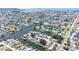 Expansive aerial view reveals a waterfront community with numerous canals and waterways, perfect for boating at 13926 Helen Ave, Hudson, FL 34667