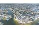 Extensive aerial view of waterfront properties, restaurant, and marina nestled along winding canals and bay at 13926 Helen Ave, Hudson, FL 34667
