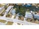Aerial perspective of a waterfront neighborhood with homes, canals, and docks at 13926 Helen Ave, Hudson, FL 34667