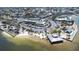 Scenic aerial shot features beachfront restaurant with boat docks, parking area, and palm tree landscaping at 13926 Helen Ave, Hudson, FL 34667