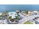 Aerial view of waterfront restaurant featuring outdoor dining, parking, playground, and picturesque beachside location at 13926 Helen Ave, Hudson, FL 34667