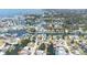 Aerial view of waterfront homes along canal ways with boat docks, leading to harbor and gulf waters at 13926 Helen Ave, Hudson, FL 34667