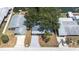 Aerial view of a property with mature landscaping and waterfront access at 13926 Helen Ave, Hudson, FL 34667