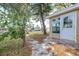 Backyard view shows door to the house, landscaping, and waterfront at 13926 Helen Ave, Hudson, FL 34667