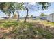 Well-manicured backyard overlooking the waterway with nearby docks at 13926 Helen Ave, Hudson, FL 34667