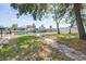 Beautiful yard with a stone pathway leading to waterfront and docks at 13926 Helen Ave, Hudson, FL 34667