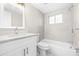 Bright bathroom featuring tub/shower combo with modern vanity and fixtures at 13926 Helen Ave, Hudson, FL 34667