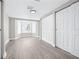 Spacious bedroom featuring new floors, a bright bay window, and closet space at 13926 Helen Ave, Hudson, FL 34667