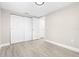 Neutral bedroom featuring new floors, a bright window, and ample closet space at 13926 Helen Ave, Hudson, FL 34667
