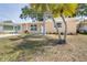 Charming single-story home with a white door and well-maintained front yard at 13926 Helen Ave, Hudson, FL 34667