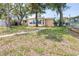 Charming home with a well-maintained lawn and a brick walkway to the front entrance at 13926 Helen Ave, Hudson, FL 34667