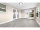 Bright sunroom with tile floors, views of the outdoors, and multiple access points at 13926 Helen Ave, Hudson, FL 34667