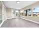 Bright sunroom with tile floors and views of the outdoors and canal at 13926 Helen Ave, Hudson, FL 34667