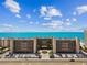 Aerial shot of a condo complex with stunning ocean views and convenient beach access at 14900 Gulf Blvd # 212, Madeira Beach, FL 33708