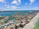 Aerial view of the condo buildings, intercoastal waterways and sandy beach at 14900 Gulf Blvd # 212, Madeira Beach, FL 33708