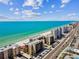 Aerial view of beachfront condo complex by the beach with an amazing ocean view at 14900 Gulf Blvd # 212, Madeira Beach, FL 33708