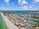 Stunning aerial view of the beach condos, coastline, and ocean waterways at 14900 Gulf Blvd # 212, Madeira Beach, FL 33708
