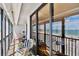 Spacious balcony with seating, perfect for enjoying stunning beach and ocean views at 14900 Gulf Blvd # 212, Madeira Beach, FL 33708