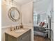 Updated bathroom vanity with granite countertop, modern fixtures, and unique mirror at 14900 Gulf Blvd # 212, Madeira Beach, FL 33708