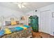 Cozy bedroom featuring unique decor, wood floors, and closet for ample storage at 14900 Gulf Blvd # 212, Madeira Beach, FL 33708