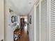 Hallway featuring wood floors and decoratively adorned wall at 14900 Gulf Blvd # 212, Madeira Beach, FL 33708