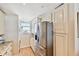 Kitchen with stainless steel refrigerator and white cabinets at 14900 Gulf Blvd # 212, Madeira Beach, FL 33708
