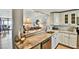 Kitchen with granite countertop and view into living room at 14900 Gulf Blvd # 212, Madeira Beach, FL 33708