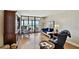 Open concept living area featuring water views, comfortable seating, and easy access to a private balcony at 14900 Gulf Blvd # 212, Madeira Beach, FL 33708