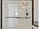 A beautifully remodeled shower with clear glass doors and modern fixtures at 14900 Gulf Blvd # 212, Madeira Beach, FL 33708