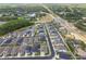 Community aerial view of a meticulously planned neighborhood near lush greenery, ponds, and a major roadway at 1499 Gopher Loop, Tarpon Springs, FL 34689