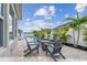 Enjoy a beautiful backyard with a fire pit, seating area, and a sparkling pool on sunny days at 1499 Gopher Loop, Tarpon Springs, FL 34689