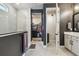 Elegant bathroom features a modern shower, walk-in closet, and sleek vanity for a luxurious experience at 1499 Gopher Loop, Tarpon Springs, FL 34689