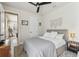 Bright bedroom featuring a ceiling fan, rug, and decor that create a relaxing atmosphere at 1499 Gopher Loop, Tarpon Springs, FL 34689