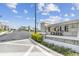 A welcoming community entrance with manicured landscaping, adding to the neighborhood's charm at 1499 Gopher Loop, Tarpon Springs, FL 34689