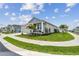 Lovely single-Gathering home with well-manicured lawn, inviting front porch, and a charming exterior at 1499 Gopher Loop, Tarpon Springs, FL 34689