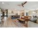 Open-concept living space with seamless flow between the living room, kitchen, and dining areas at 1499 Gopher Loop, Tarpon Springs, FL 34689