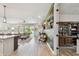 Open-concept living room with natural light, wood flooring, and view of the pool area at 1499 Gopher Loop, Tarpon Springs, FL 34689
