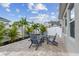 Enjoy the outdoor space with a cozy seating area around a fire pit, surrounded by lush landscaping at 1499 Gopher Loop, Tarpon Springs, FL 34689