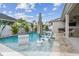 Relax by the pool with in-water seating and sun umbrella, perfect for enjoying sunny days at 1499 Gopher Loop, Tarpon Springs, FL 34689