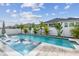 Beautiful backyard featuring a sparkling pool, lounge chairs, and lush tropical landscaping at 1499 Gopher Loop, Tarpon Springs, FL 34689