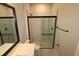 Sleek bathroom design with a glass-enclosed shower, modern fixtures, and a bright, clean aesthetic at 1631 Springwell Ln, Sarasota, FL 34240